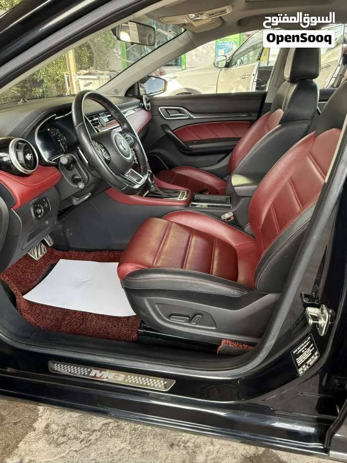 MG 6 THROGHY 
MG6 الفول مواصفات
مرقم بصره بأسمي رقم دولي 
عداد المسافة 32 الف كيلو
محرك 1.5 تيربو
ناقل سرعة دبل كلتش 7 سرعات
قوة المحرك 169 حصان
عزم الدوران 250 نيوتن / متر
مصابيح نهارية LED
مصابيح خلفية LED
مرايا كهربائية
اشارات في المرايا الكهربائية
مرايا قابلة للطي بشكل الكتروني
مقود جلد
مكابح توقف الكترونية EPB
مكابح انتظار الكترونية Auto Hold
نظام الثبات الالكتروني ESP
نظام توزيع قوة الكبح EPD
نظام مكابح المنعطفات CBC
نظام مراقبة ضغط الهواء في الاطارات
تكييف الكتروني ثنائي المنطقة
نوفذ كهربائية مع فتخ واغلاق اوتوماتيكي
مثبت سرعة
ناقل سرعة في المقود ( بادل شيفتر )
بصمة
مسند يد خلفي مع حامل اكواب
مقود قابل للتعديل
شاشة 8 انش مع كاميرا
بلوتوث
مداخل USP مع شاحن
مداخل كهرباء 12 فولت
Android Auto
Apple Car Play
تحكم بالمقود
حساس خلفي
شاشة عدادات 3.5 انش
عادم مزدوج ) دبل اكزوزت ( فتحة سقف
دوسات بنزين وبريك معدنية رياضية
جنط 18 المنيوم
اطارات بروجستون
مقاعد جلد
مقعد سائق كهربائي ب 6 حركات
6 وسائد هوائية
نوفذ كهربائية مع فتح واغلاق اوتوماتيكي لجميع
النوافذ
نظام الاضاءة التلقائية
اغلاق النوافذ تلقائيا عن قفل السيارة

ضمان 6 سنوات او 200,000km ايهما اقرب

التواصل على الرقم ***********

نص مكتوب في الصور:
- السوق المفتوح OpenSooq