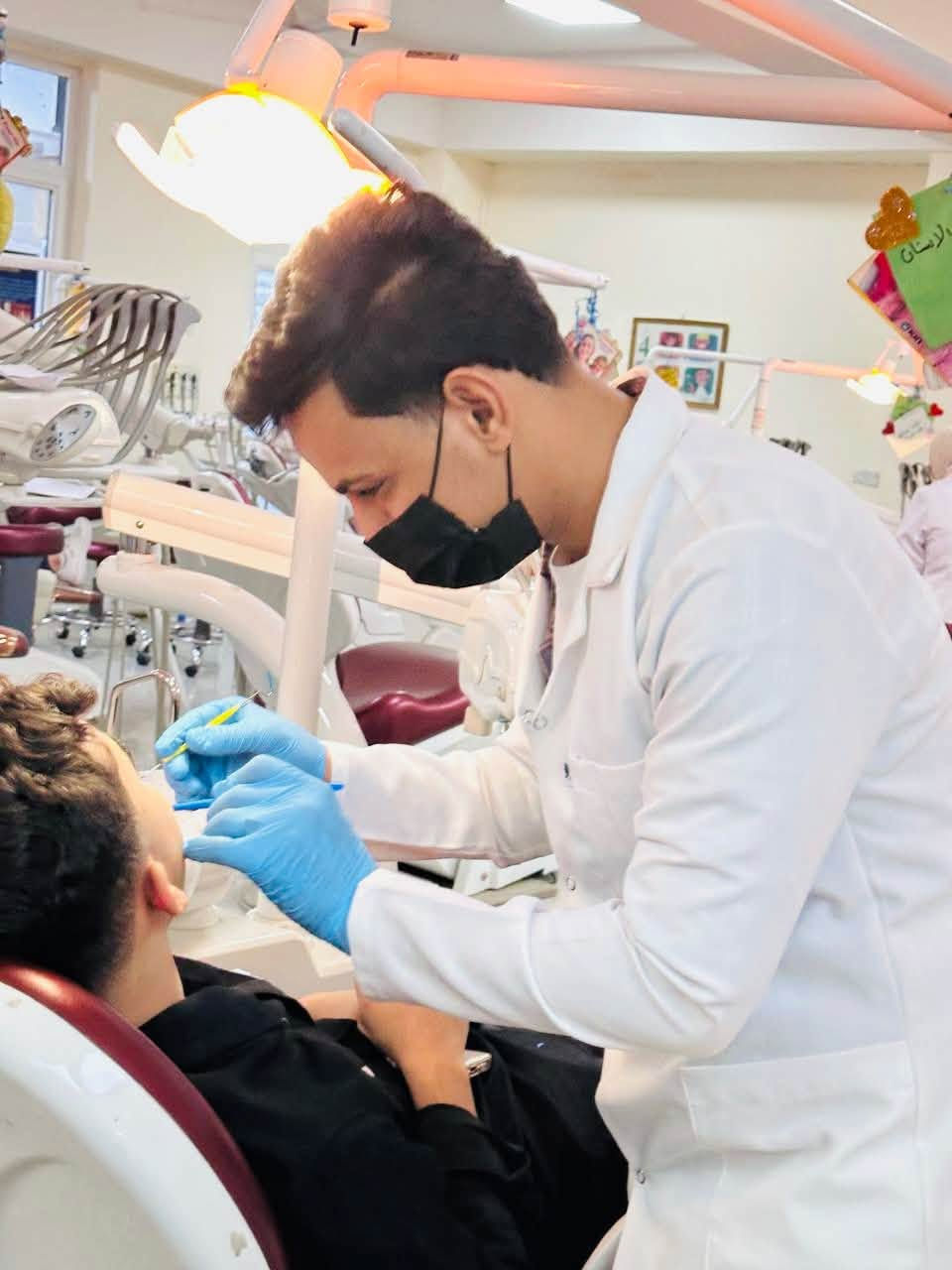 الكرادة • علاج مجاني • تنظيف تسوس قلع