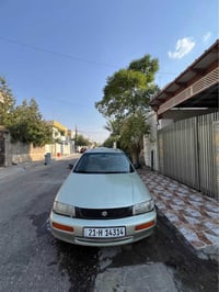 مازدا ٣٢٣ • موديل ١٩٩٥ • قير عادي