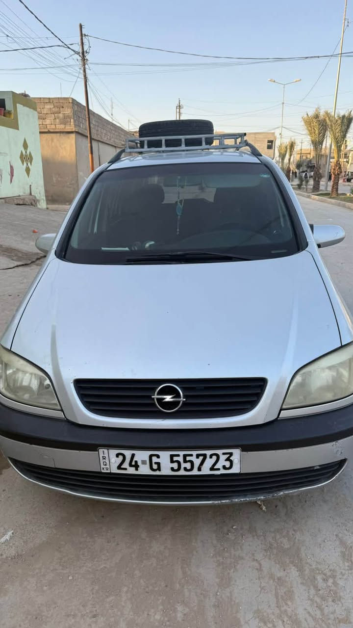 النوع والموديل: أوبل زافيرا (Opel Zafira) - موديل 2002.
 المساحة: 7 راكب (عائلية ومريحة جداً للسفر والطلعات).
سياره : مكفولة من الصبغ العامة، بيها كم مكان تعديل بارد بسيط فقط بدون صبغ.
 التبريد: تبريد شغال وممتاز.
 الرقم والسنوية: رقم دهوك، أوراقها كاملة وجاهزة للتحويل.
 المواصفات والإضافات: سلة سقفية للأغراض + قاطرة خلفية، متانة ألمانية واقتصادية جداً بالبنزين.
مكان المعاينة: الموصل - الجانب الأيسر
للتواصل واتساب أو اتصال: ***********
‏تفاصيل اكثر الاتصال
