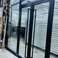 واجهات زجاج • كيرتن وول • أبواب كهربائية