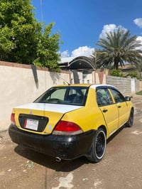لانسر • ٢٠١٠ • بنزين وغاز