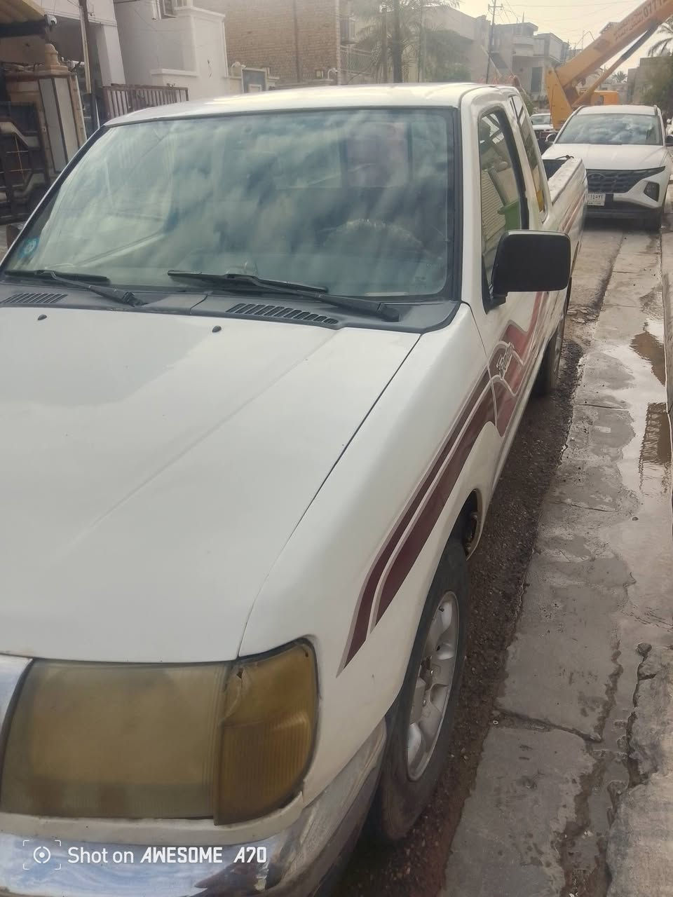 عندي بيكب نيسان 2000 كير اوتو بلاد تعليك محرك ونجي 6 سلندر بيه جراد مصبوغة صورته الاصابع موجودة مال الجراد حزام تبريد تخم تاير رقم بغداد سنويه لل28 بأسمي مكان السيارة بغداد نفق الشرطه واتس اب***********

نص مكتوب في الصور:
- Shot on AWESOME A70
