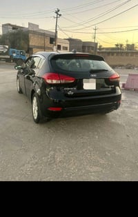 كيا فورتي موديل 15 هاش باك5 رقم بغداد انكليزي بأسمي مواصفات EX سنتر لو...