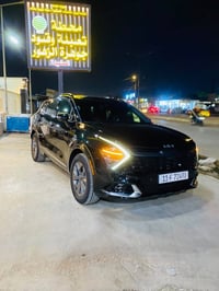 سبورتاج هايبرد • دفع رباعي • داخلية حمراء