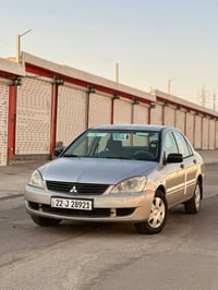 لانسر ٢٠١٠ • محرك جديد • بدون صبغ