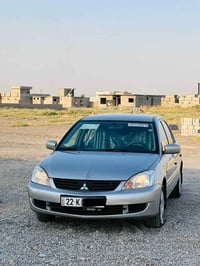 لانسر 2010ماشيه 170 رقم أربيل هزه وسنويه وفحص جديد  كير ومحرك بشرط ما ...
