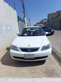 مازدا 323 • كركوك • كوبون بنزين