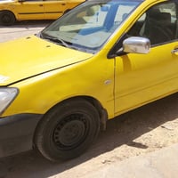 لانسر للبيع موديل 2010مكينه كير كفاله مابيها حادث بس الهلالات معمره اث...