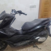 Pcxجيل ثاني محرك 150 ما مفتوح  عل فحص   ياباني مو ماليزي.  دراجه متضرر...