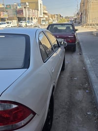 نيسان ٢٠٠٩ رقم بغداد انكليزي  بأسمي مداور ثاني يوم السيارة بيه الجاملغ...