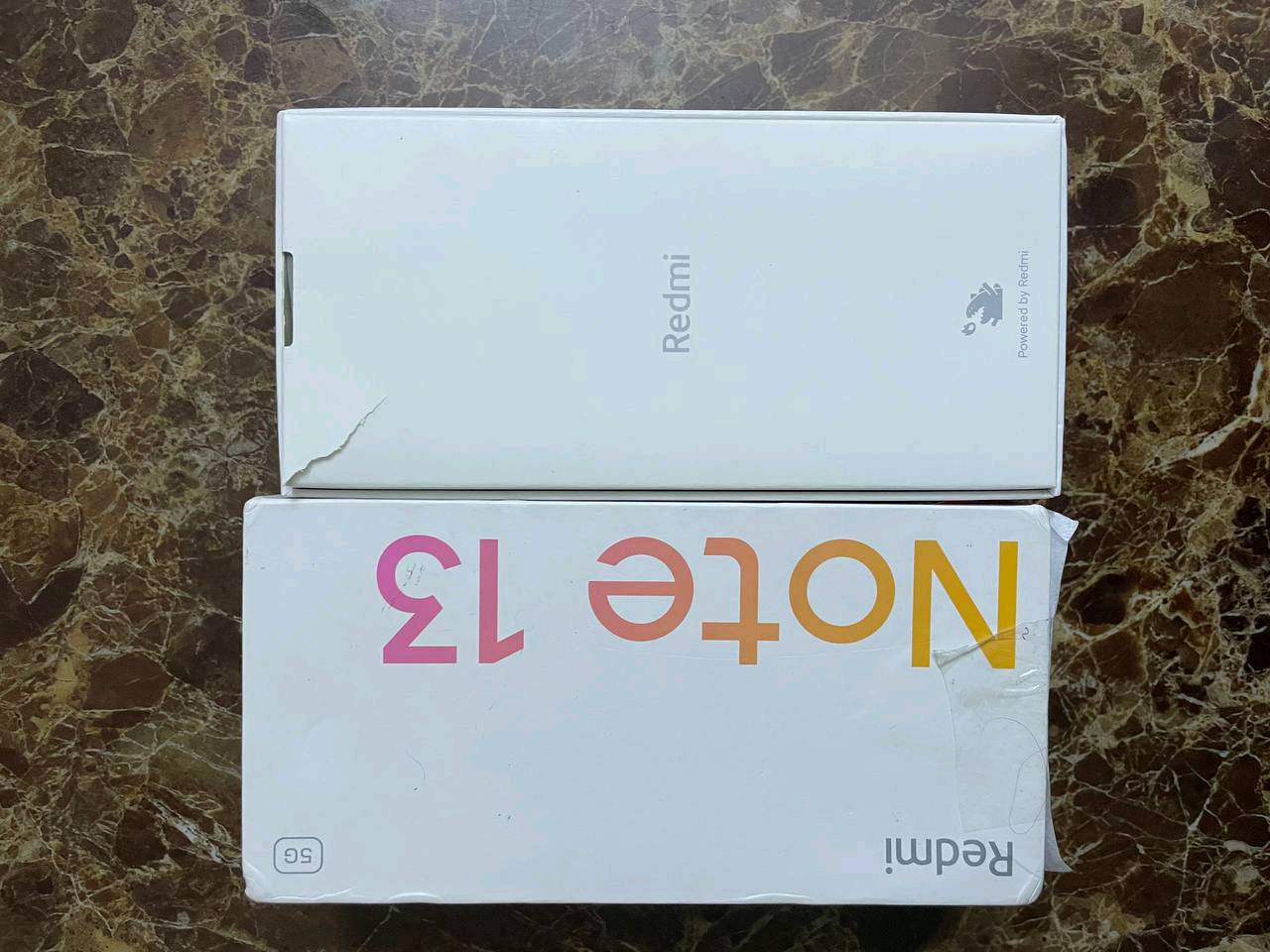 ريدمي نوت 13 5G طك كارتون نضافة 100 شاشة 120هيرتز فريم 120 أو نكول 90 ببجي فول نضافة كامرة 180 مبكة بكسل
ممكن تذكرلي شنو السعة والرام بالضبط؟ يعني 5G شكد جيجا وشنو موديل Redmi Note 13 5G الكامل؟: 
128ذاكرة
الجهاز جديد لو مستخدم؟ وإذا مستخدم، شكد مدة الاستخدام تقريباً وهل بيه أي خدش أو أثر استعمال ولو بسيط؟: 
جديد اي خدش ما بي 
شنو الموجود ويا الجهاز بالضبط داخل العلبة: الشاحن، السلك، الإبرة، الكفالة أو أي ملحقات ثانية؟: 
كارتونة بس 
وين موقعك بالعراق حتى المشتري يگدر يستلم ويفحصه؟ والسعر شكد نهائي لو بيه مجال للمساومة؟: 
بغداد البلديات بي مجال للتفاوض