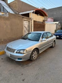 أوبتيما ٢٠٠١ بسمي رقم بغداد دولي كير ومكينه وتبريد وحداديه كله جاهز ما...