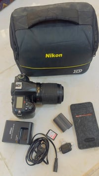 نيكون D7000 • عدسة 55-200 • كامل ملحقات