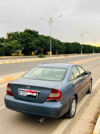 كامري ٢٠٠٢ • رقم بغداد • قير مكفول