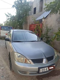 لانسر ٢٠٠٧ • أوتوماتيك • كفرات جديدة