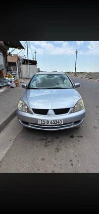 لانسر 2011 محرك 1600 بغداد باسمي  رقم انكليزي هزه وسنويه 2031 سياره نض...