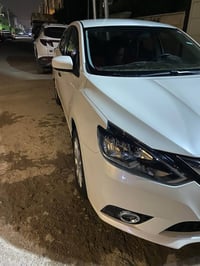 نيسان سنترا  2025  رقم اربيل الجديد بأسمي المواصفات   السياره ماشيه 26...