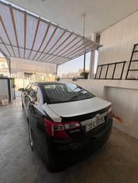 كامري٢٠١٤ خليجي124$ SE ٢پارجه و په له يه ك بوياخه بي مه سروف 077326586...