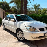 شباب لانسر موديل 2011 الشركه العامه رقم بغداد الدولي السياره بيهه شويه...