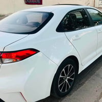 تيوتا كورلا 2025 هايبرد  شكل أمريكي مرقم بغداد وجاهز سنويه وبليت بسمي ...