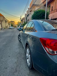 شۆفر لێت کروز ٢٠١٠ مەکینە ئۆپترا مەرغوب ڕەنگ چیمەنتۆی- کوشن جلد- ناو خ...