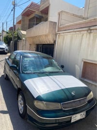 كيا كريدوس • أحمر • جير عادي
