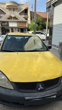 لانسر 2010 رقم بغداد الجديد اوتوماتك للبيع 07713718521