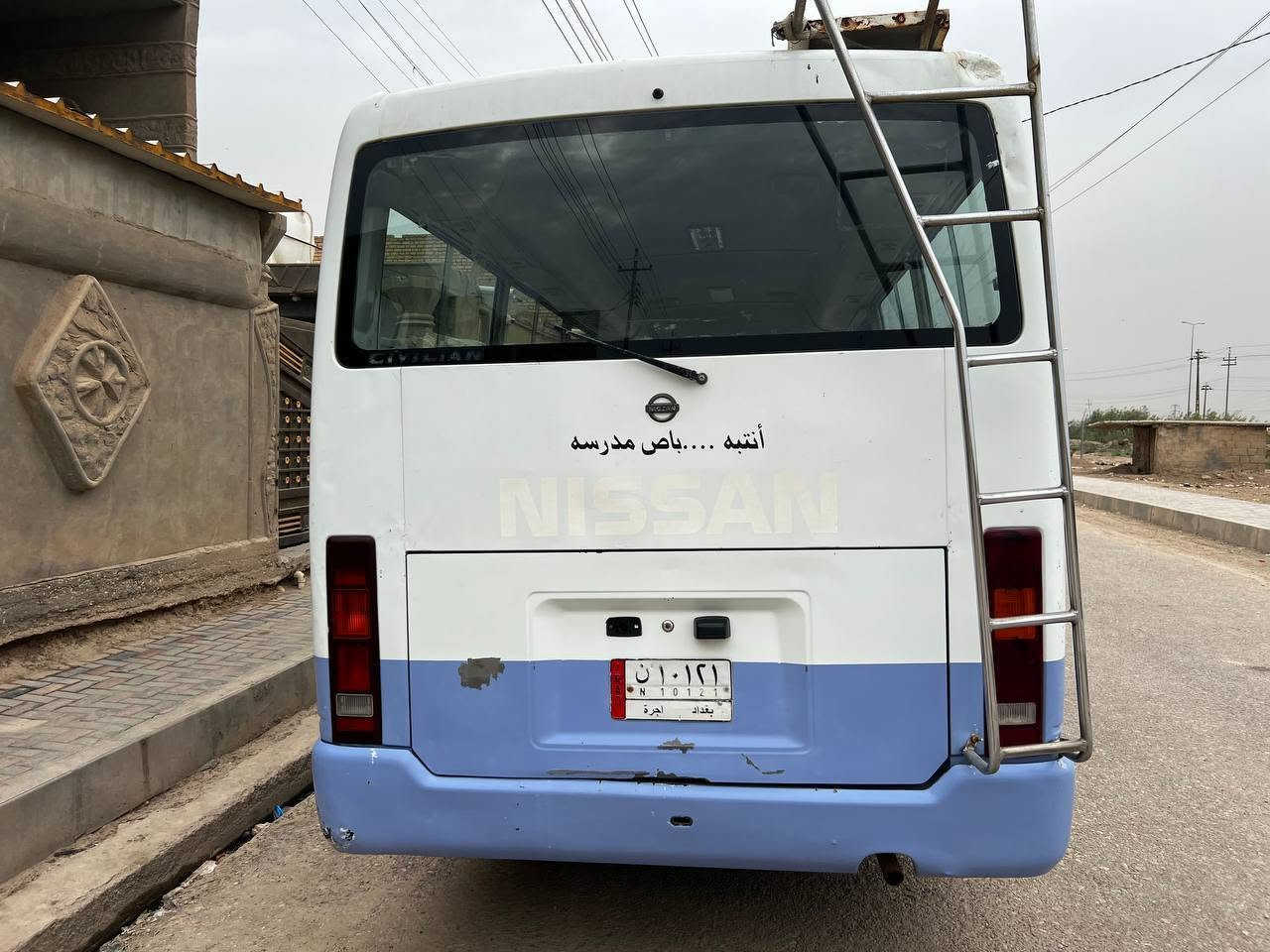 كوستر نيسان • ٢٠٠٢ • رقم بغداد