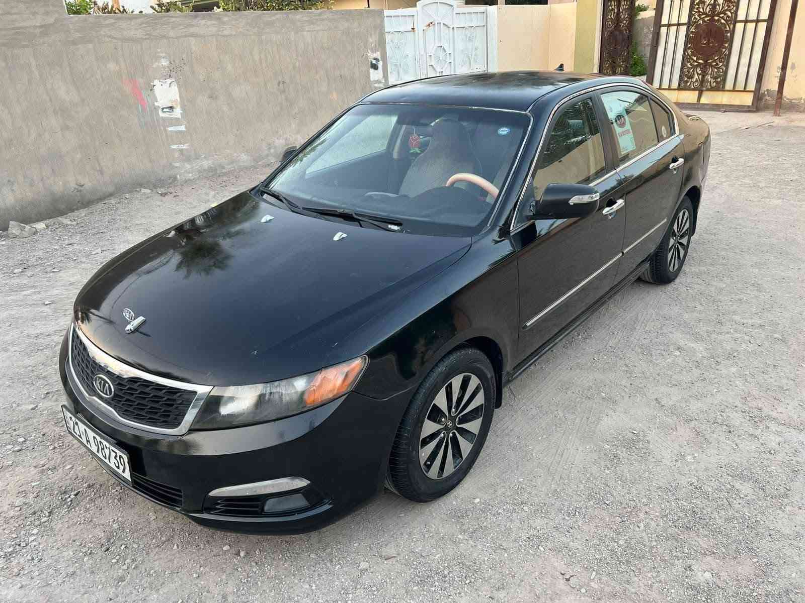 سلام عليكم كيا اوبتيما 2010 خليجي مكفولة من الحادث
بيها قطعتين صبغ بدون دواخل سونار مع الصور 
رقم سليمانيه نكليزي بسمي سنويه الغايه 28 تحويل مباشر 
سياره جاهزه من كلشي السعرر $ (80) بيها مجال قليل 
مكينه 2000 دوش مكينه كير مكفولات شرط ماا مفتوحات 
لا صرف لا بخار صدر امامي خلفي جديد تبريد ثلج تخم تاير 
سياره جاهزه ميكانيك كله جديد منضومت زنون ثلجي 
مكاني ديالى بعقوبة رقم هاتف ***********
