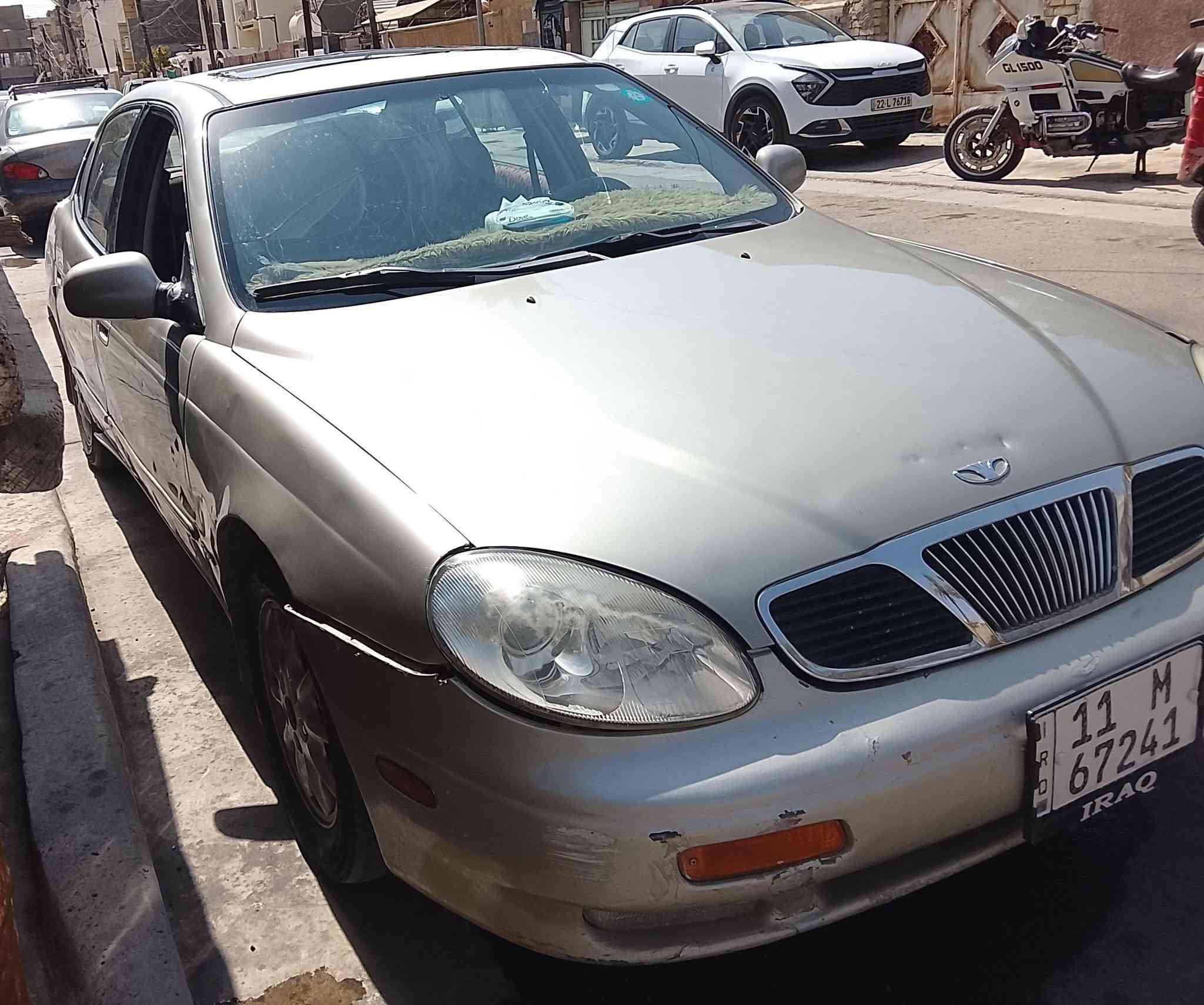 السلام عليكم 
دايو ليكنزا رقم بغداد إنكليزي باسمي موديل 2000محرك 1600كير أوتو وارد أمريكي 27ورقةشرط التحويل ***********
