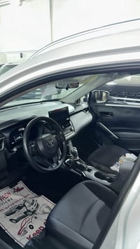 للبيع !! كورلا كروس هايبرد  2025  الممشى 13.000km  07711119817  28,500...