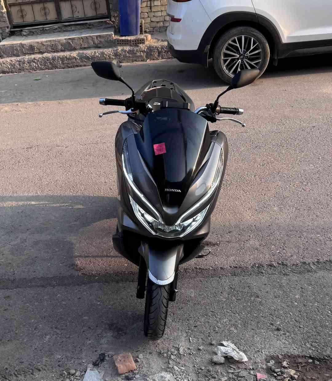 سلام عليكم PCX جيل الثالث ياباني
 نازله من المعرض قبل شهرين 
ابيعلك عله صور مزاد اليابان 
الدراجه بحاله الوكاله وياها منفيسهة وكتلوكاتهة 
وبيه شاشه كاربلي الدراجه ولا غلطه كفاله حته من الطسه
حساس ازدحام✅
حساس ستان ✅
الدراجه كفاله من التاير للتاير اي نقص مابيه  
وشرط الضمان ✅
مكاني الامين الثانيه شراي اتصل*********** 📞

نص مكتوب في الصور:
- Cost calculation
- Price in yen
- 214 .000 ¥
- Finish price in yen
- 000 000 ¥
- Calculate
- Overall rating
- 5
- Year of registration
- 2018
- Mileage
- 25 247 km
- Displacement
- 125 cc
- Frame
- JF81-1030135
- Engine number
- JF81E-5030122
- Color
- gun-metal
- Average price
- 237 000 ¥
- 197 068 ¥
- Auction comment
- 各所変色大。外装仕上げ油。
- Similar sales
- Rank 5 bikes Monthly Sales
- Data Sold 28 bikes in the
- range of ¥184,000 to
- ¥242,000
- Sales statistics
- Previously sold?
- 5/7
- Motorcycle photo