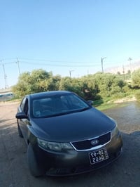 كيا سيراتو • ٢٠١١ • بني