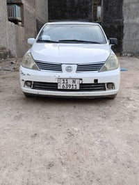 نيسان تيدا للبيع موديل ٢٠١٣ بيه جاملغ خلفي لون ابيض سياره بلاديه ماشيه...