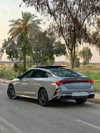 K5 GT 2024 للبيع لون سمنتي داخل قرميدي مكينه 2500T حادث بنيد مبدل ومصب...