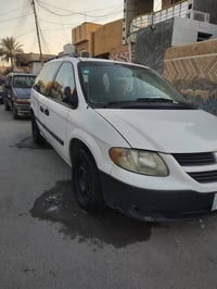 دوج كرفان موديل 2007 محرك وكير مكفولات 2400 رقم بغداد انكليزي بأسمي كه...