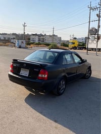 مازدا 323 • ٢٠٠٠ • گير عادي