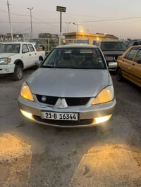 لانسر موديل 2009 للبيع سياره محرك 1.5 تبريد ثلج تخم تاير صدر امامي وخل...