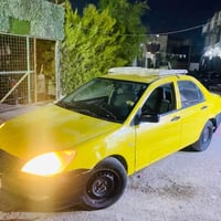 لانسر موديل 2010باسمنه جاهزة كبل للشارع حدادية مكينة كير   بس بيها خيا...