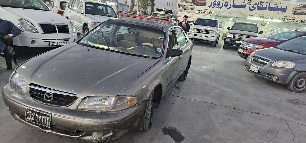 مازداي ٢٠٠٠ سه نه ويي و وه كاله و ارم بلاستيك سه ياره. كي بي ده عمه گيري به شه رته مه كينه ي توزي دوكه لي هه يه نرخي ١٤ وه ره قه شوين هه ولير موبايل *********** اكر, نينوى

نص مكتوب في الصور:
- ***********