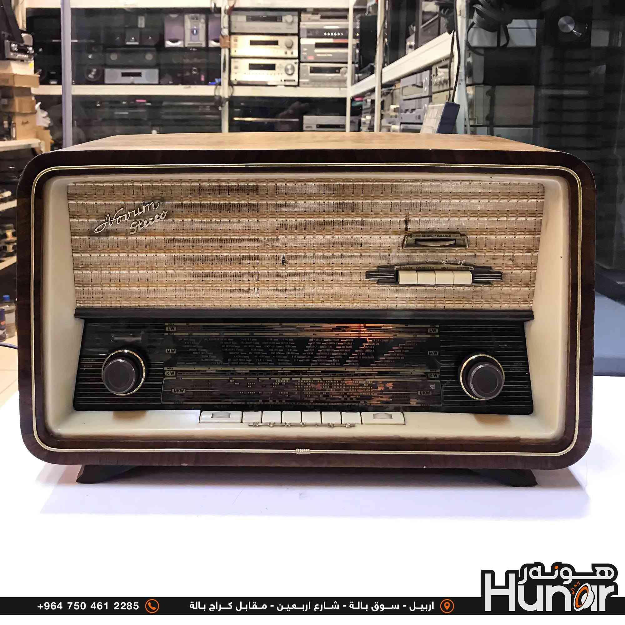 KORTING RADIO CLASSIC FM
هذا الجهاز هو راديو لامابي (أنبوبي / Vacuum Tube) ألماني كلاسيكي من طراز Novrum Stereo (صُنع بواسطة شركة Körting لشركة Delmonico).

​تفاصيل الجهاز:

​الموجات (عدد الموجات/الموجات المتاحة): يحتوي على 4 موجات رئيسية يُمكن التبديل بينها عبر مفاتيح التحكم والأزرار في واجهة الترددات: 
​عمر الراديو: 

​سنة الصنع: صُنع هذا الطراز في بداية ستينيات القرن الماضي (حوالي 1961 - 1964). 

​العمر: يتجاوز عمره 60 عاماً (نحو 62 إلى 65 سنة). 

​ملاحظات إضافية: 
( کوردی • عربي )

🟢توصيل موجود الي جميع المحافضات
🟡گەياندن هەیە بۆ هەموو شوێنێک

🟠مــعـرض هــونـەر
🔸للـصوتــیات(امبلیفایر• سماعة• رادیو• انتیك• مایكروفون)
🔸عــنـوان• اربیل سوق بالة • شارع اربعین
🔸مـوبایـل• ***********
                   ***********

🔵پـێـشانـگای هــونـەر
🔹بۆ ئامێری دەنگی و کارەبایی(ئیمپلیفایر• سەماعە• ڕادیۆ• مایکرۆفۆن)
🔹ناونیـشان• هەولیر • بازاری لەنگەی ٤۰م
🔹مـــۆبـایـل• 
***********
***********

•••••••••••••••••••••••••••••••••••••••••••••••••••
#iraq #kurdistan #duhok #zaxo #hawler #karbala #slemani #erbil #baghdad #kurd #kurdish #akre  #karkuk #kuwait #najaf
#amplifier #audio #subwoofer #sound #music #audiophile #bass #stereo #amplifiers #speaker #soundsystem #speakers
#اربيل #العراق #بغداد
​بلد المنشأ: ألمانيا الغربية (Western Germany).

​النظام: يعمل بتقنية الصمامات المفرغة (Vacuum Tubes) ويدعم الصوت الاستريو (Stereo).

​التصميم: الهيكل خارجي مصنوع من الخشب الطبيعي

​UKW / FM (موجات إف إم / الترددات العالية جداً)

​KW / SW (الموجة القصيرة - Short Wave)

​MW / AM (الموجة المتوسطة - Medium Wave)

​LW (الموجة الطويلة - Long Wave)

​عمر الراديو:

نص مكتوب في الصور:
- 32cm 54cm 22cm +964 750 461 2285 اربيل - سوق بالة - شارع اربعين - مقابل كراج بالة Hunar هونه ر
- +964 750 461 2285 اربيل - سوق بالة - شارع اربعين - مقابل كراج بالة Hunar
- +964 750 461 2285 اربيل - سوق بالة - شارع اربعين - مقابل كراج بالة
- +964 750 461 2285 اربيل - سوق بالة - شارع اربعين - مقابل كراج بالة Hunor
- +964 750 461 2285 اربيل - سوق بالة - شارع اربعين - مقابل كراج بالة هونر Hunar
- +964 750 461 2285 اربيل - سوق بالة - شارع اربعين - مقابل كراج بالة Húnor
- +964 750 461 2285 اربيل - سوق بالة - شارع اربعين - مقابل كراج بالة هنور Hunar