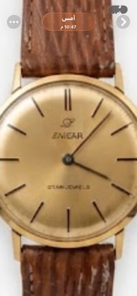 ك تقرير مفصل عن ساعة اليد الكلاسيكية "إنكار" (Enicar) الظاهرة على يمين...