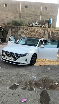 أزيرا كراندور وارد كوري  (بانزين ) محرك 4(2.5) تيربو لون ابيضّ موضح با...