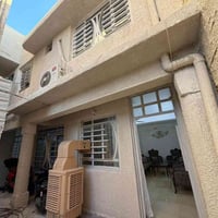 بناية تجارية • طابقين ٤شقق • سند مستقل