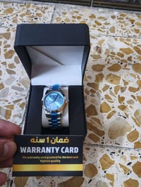 ساعه رجاليه بعدني ملابسها جديده بلباكيت مع ورقه ضمان رولكس بغداد مدينه...