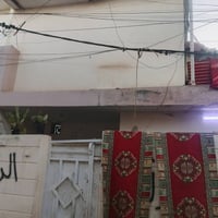 دار للبيع مساحه 100متر قرب جامع الغرير 07707834441