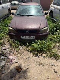 اوبل استرا موديل 2002 رقم بغداد نكليزي تحويل ثاني يوم كير عادي السعر 3...