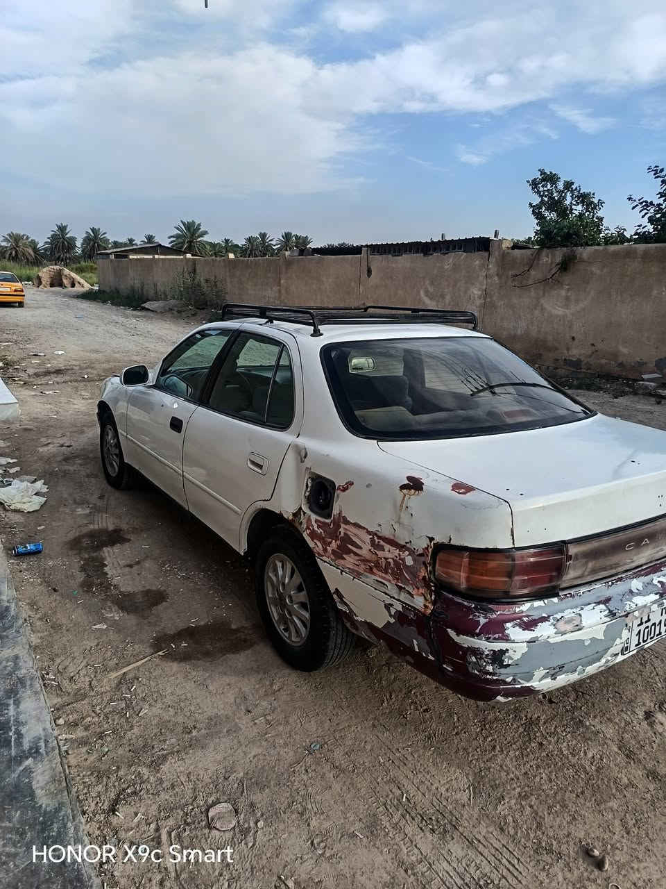 كامري موديل 92  رقم مميز  بغداد المكينه  و الكير خير من الله التيارات نضاف و زوج جديد  و البطارية جديدة تبريد ثلج و الكهربائيات شغاله 
 بس الصدر الخلفي تعبان شويه بي طوبات با اسمي تحويل ثاني يوم السعر 34 وبيها مجال
 ***********

نص مكتوب في الصور:
- HONOR X9c Smart