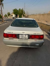 ملكه البيع ارقم بغداد بسمي   قرار ١٠٢  مديل ٢٠٠٣اصل كرستال   اربع دكم ...